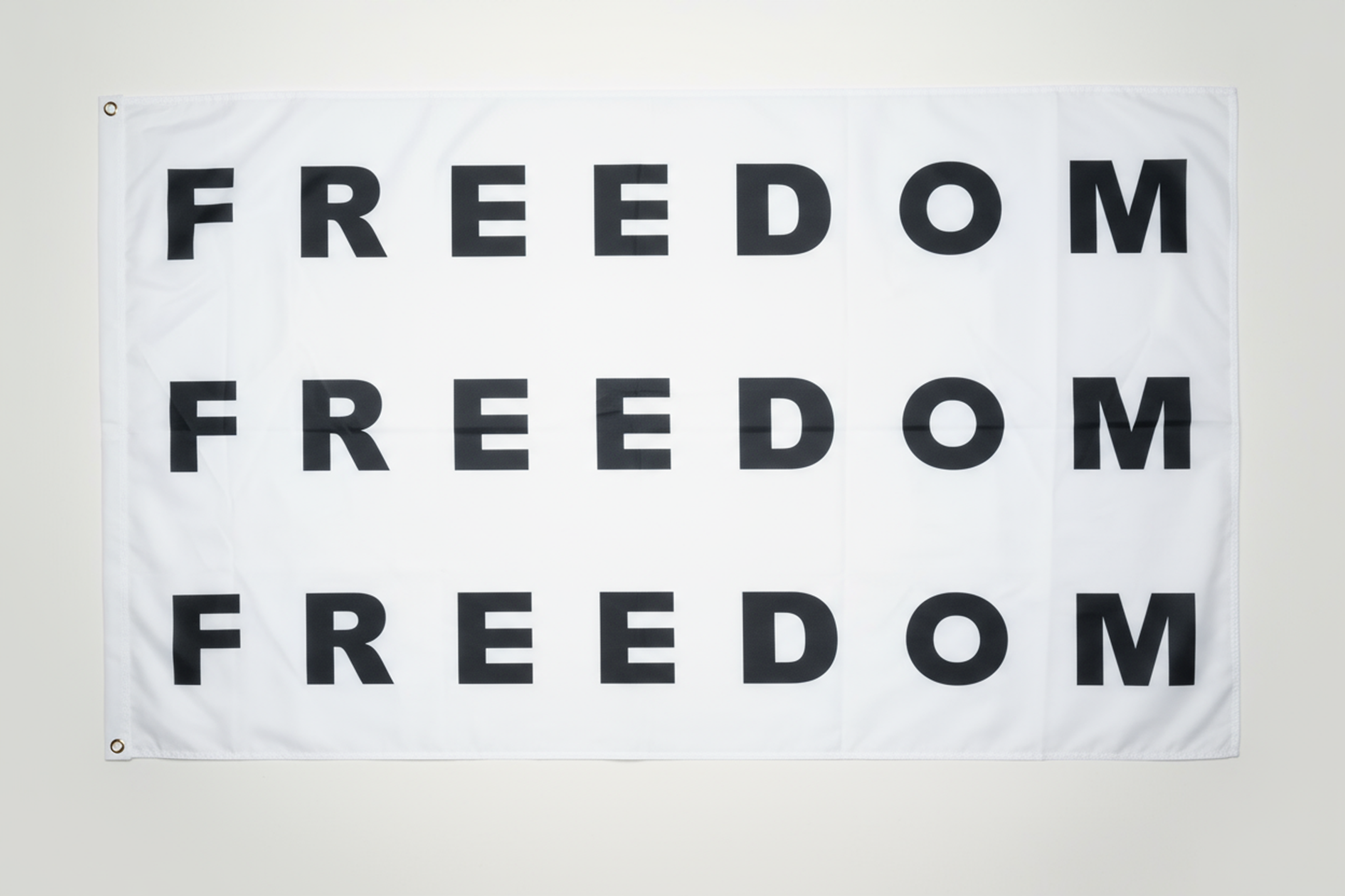 Triple Freedom Flag — Repeating Black Text Design