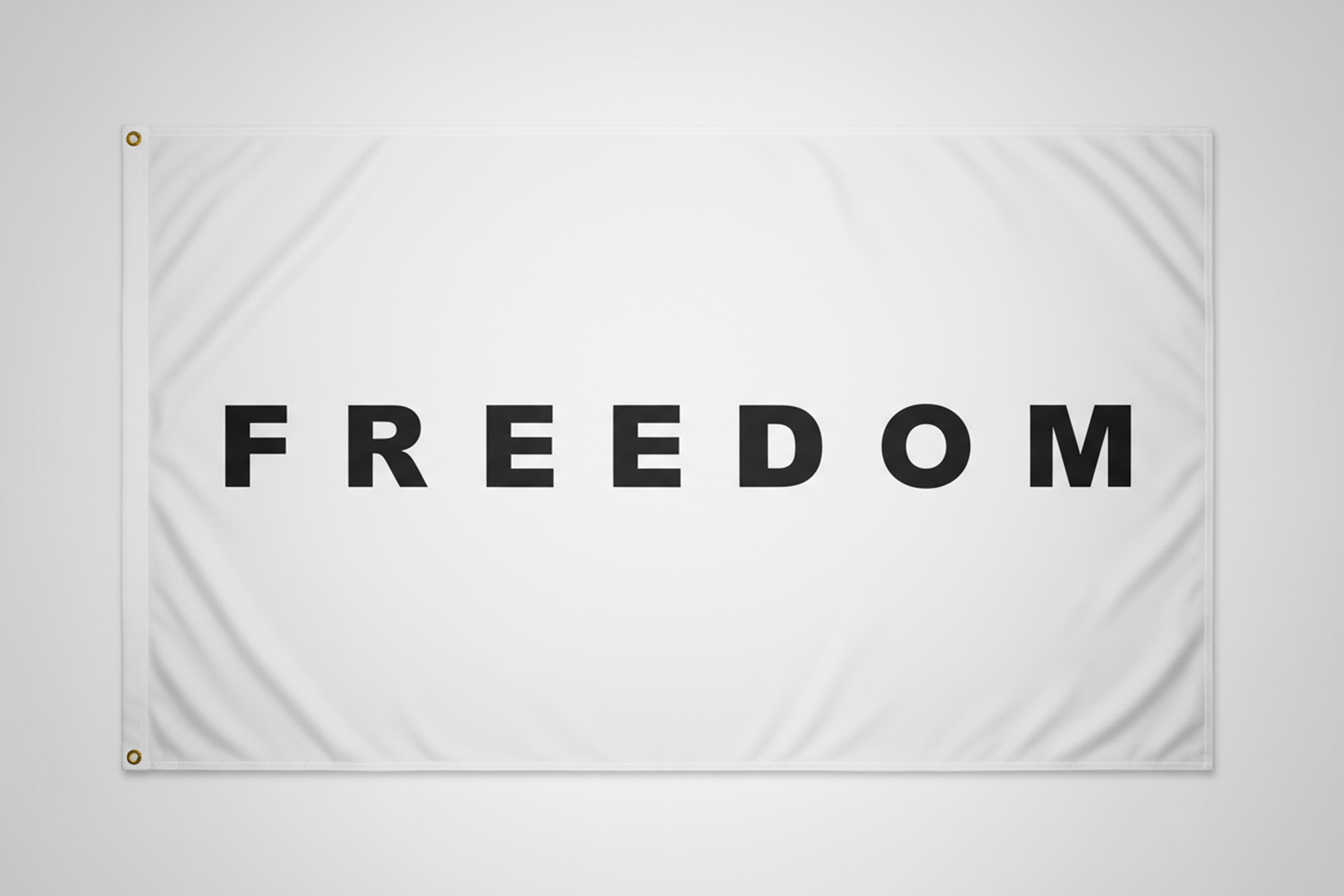 White flag with 'FREEDOM' printed on it against a white background