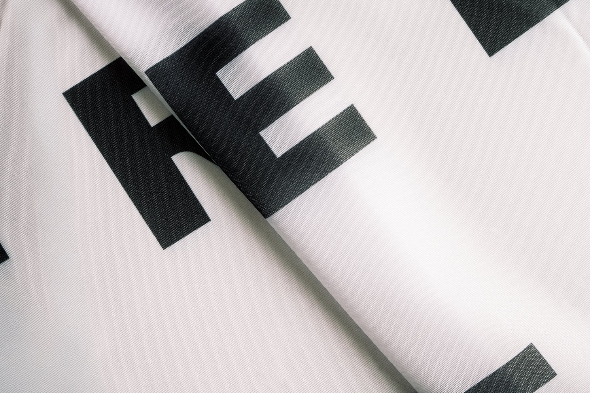 Triple Freedom Flag — Repeating Black Text Design